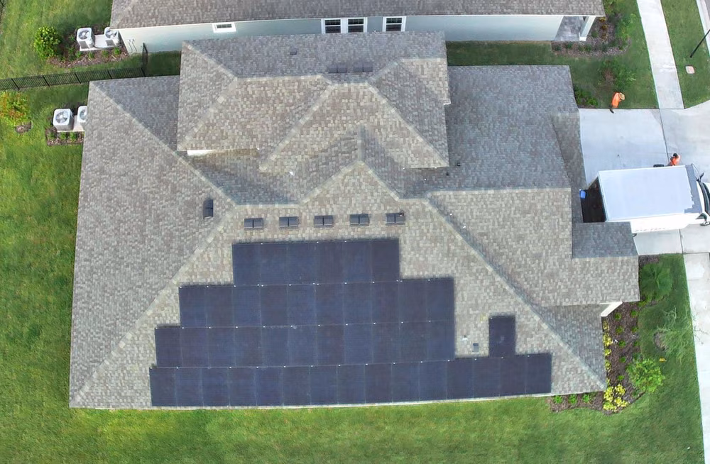 Aerial view of an all-black residential solar installation on a Tampa Bay area home by May Electric Solar